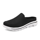 Scarpa slip-on nera da uomo con suola bianca, design casual e traspirante, ideale per passeggiate e tempo libero. Scarpe comode e leggere.
