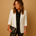 Long tailored blazer for women with a structured fit and classic lapels, ideal for business outfits and formal occasions.