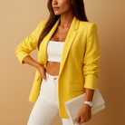 Long tailored blazer for women with a structured fit and classic lapels, ideal for business outfits and formal occasions.